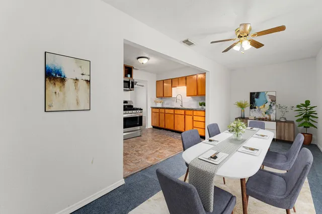 a view of a dining room with furniture