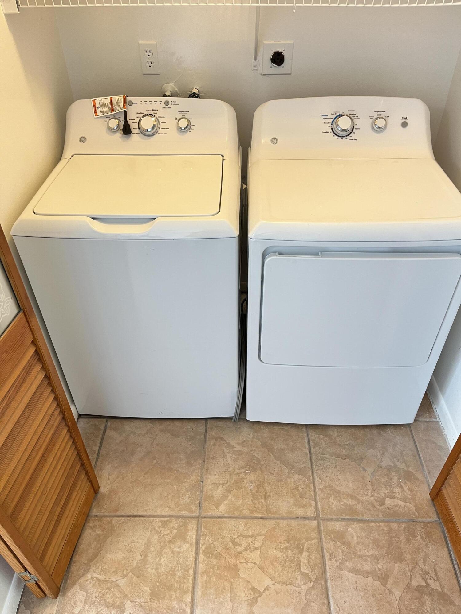 431 Jupiter Lakes Boulevard, Unit 2104C Jupiter, FL 33458 - Photo 15 of 28 a utility room with dryer and washer