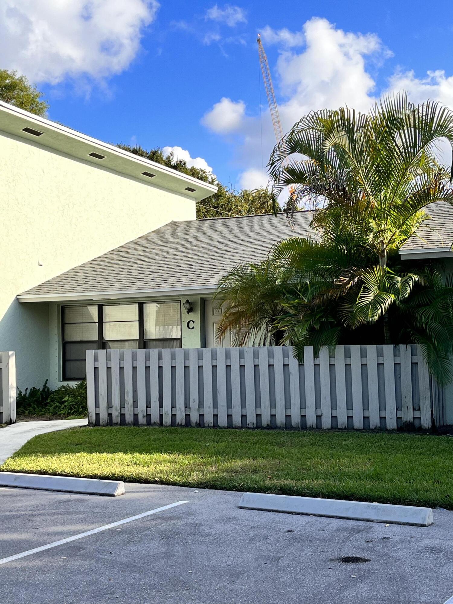 431 Jupiter Lakes Boulevard, Unit 2104C Jupiter, FL 33458 - Photo 16 of 28 a view of a backyard with a garden