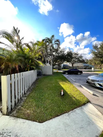 a view of a backyard with swimming pool