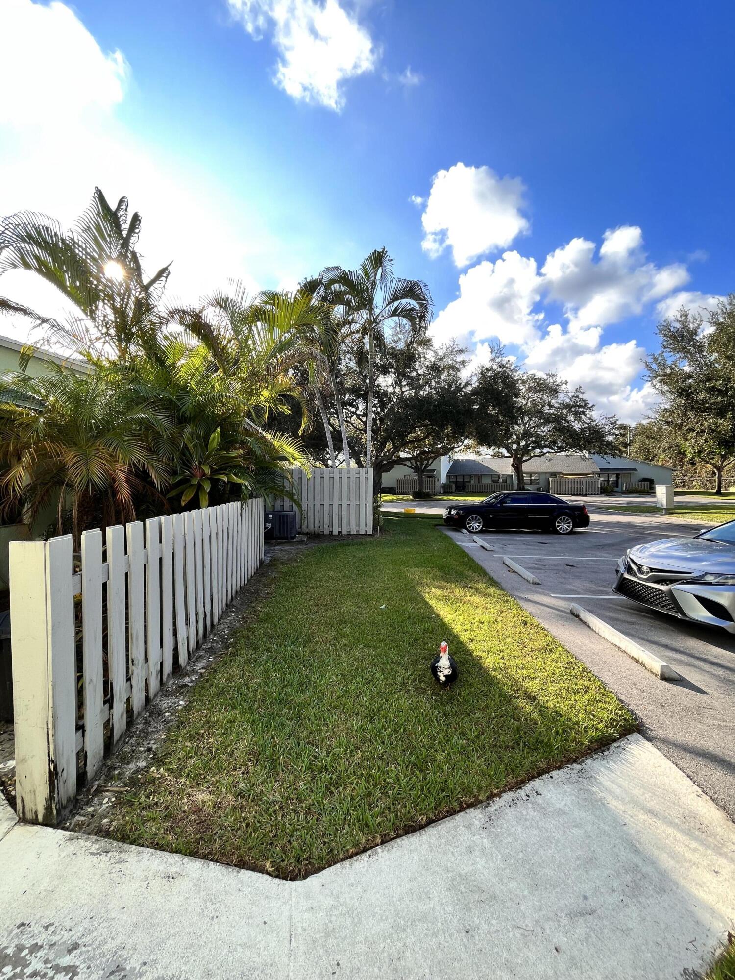 431 Jupiter Lakes Boulevard, Unit 2104C Jupiter, FL 33458 - Photo 19 of 28 a view of a backyard with swimming pool