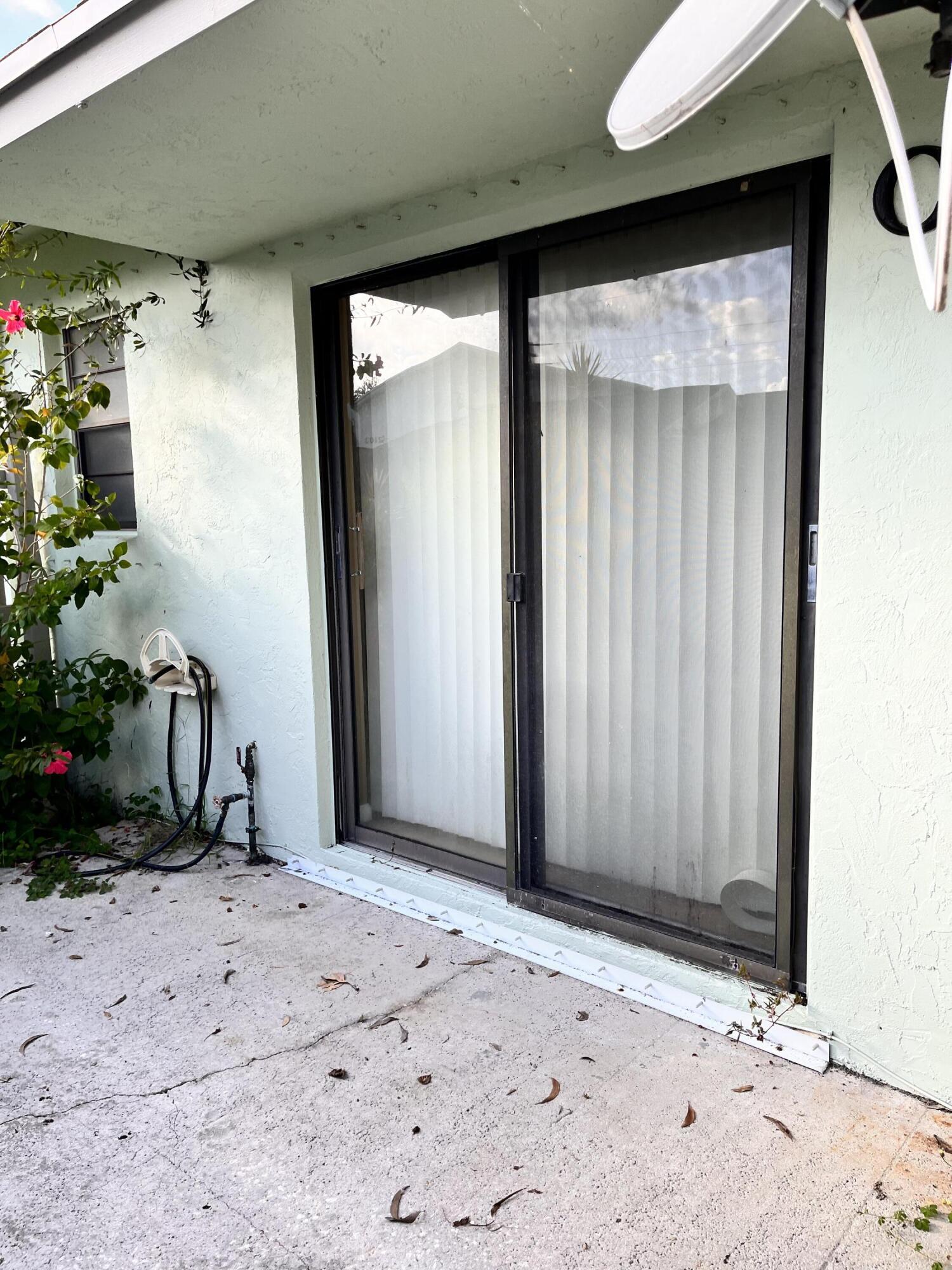 431 Jupiter Lakes Boulevard, Unit 2104C Jupiter, FL 33458 - Photo 21 of 28 a view of wooden door