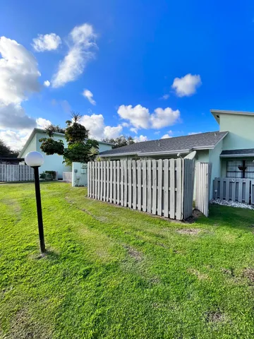 a view of a backyard with a house