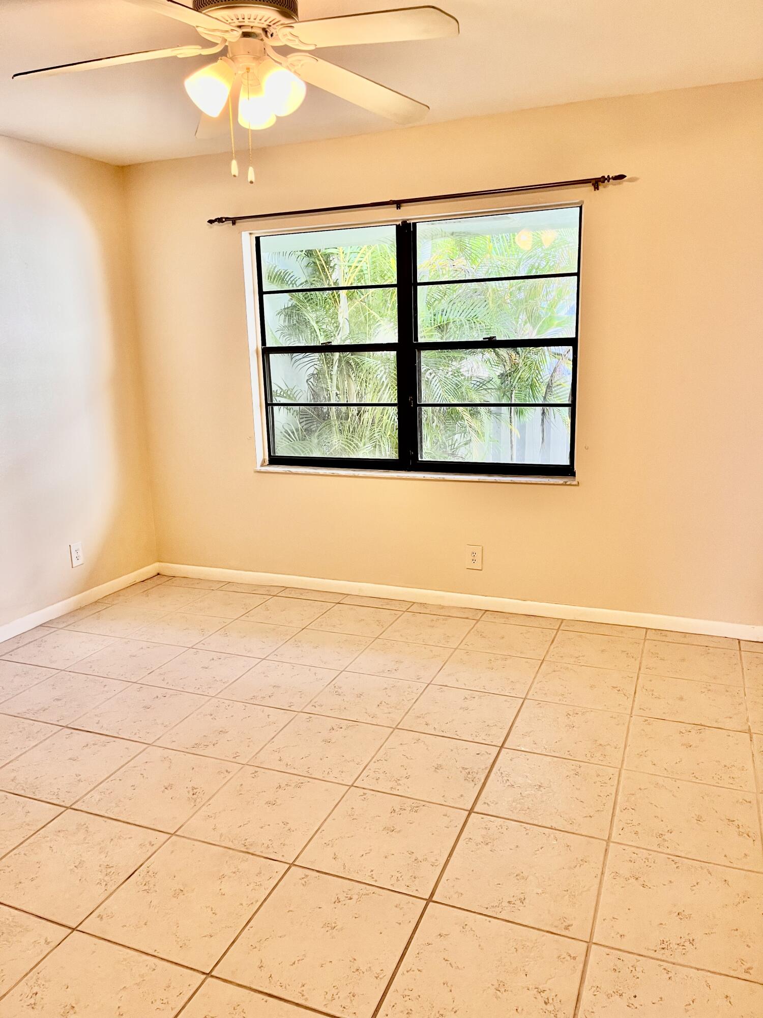 431 Jupiter Lakes Boulevard, Unit 2104C Jupiter, FL 33458 - Photo 25 of 28 an empty room with a window