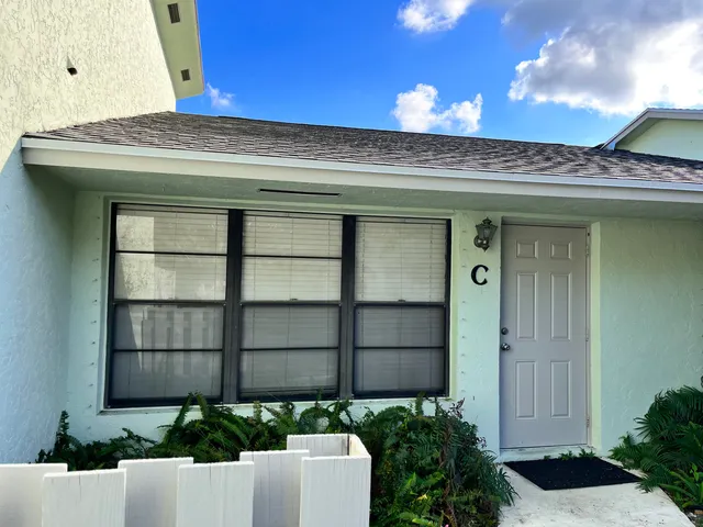 a view of a potted plants in front of a house