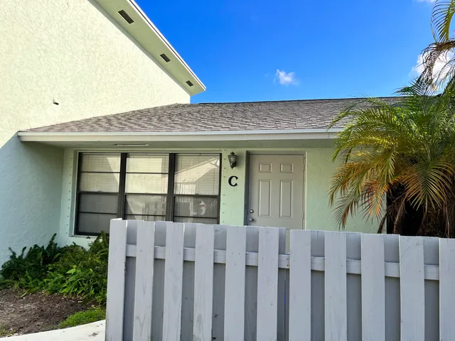 a front view of a house with a garage