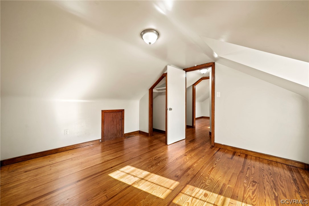 10121 Highview Road Glen Allen, VA 23059 - Photo 18 of 24 Bonus room with lofted ceiling and wood-type floor