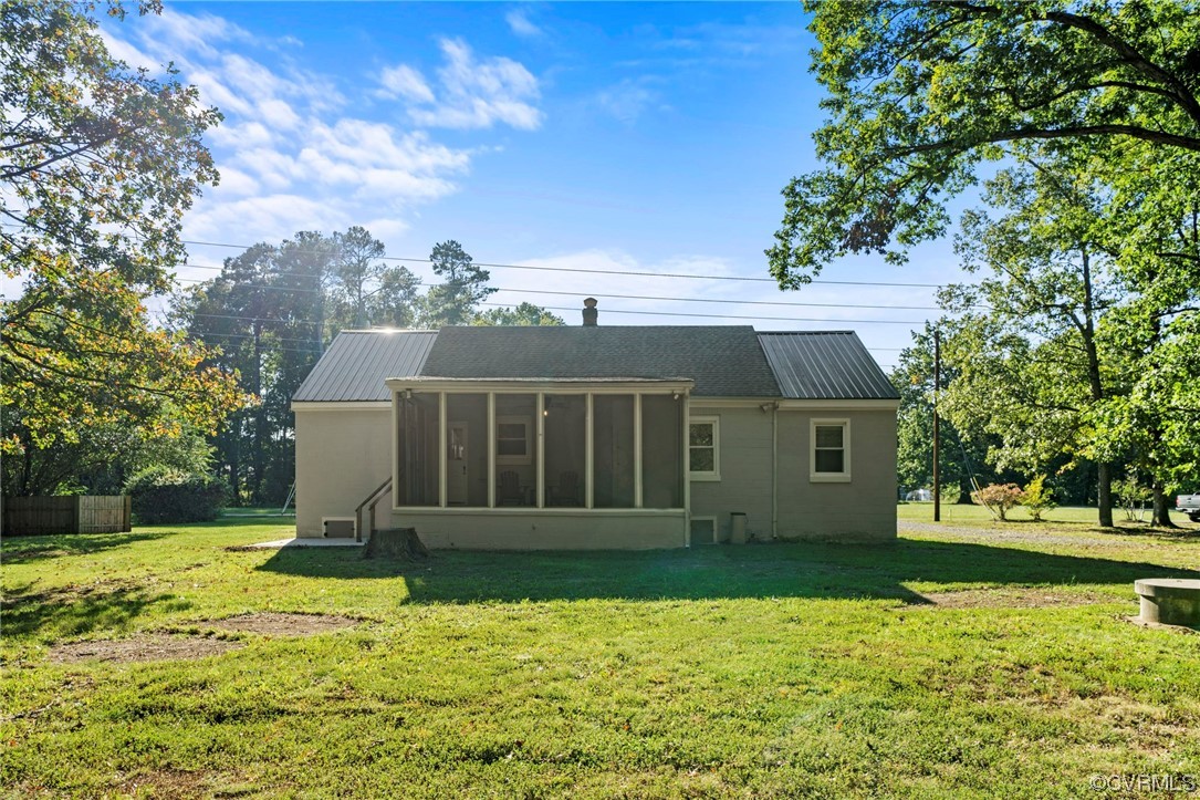 10121 Highview Road Glen Allen, VA 23059 - Photo 22 of 24 Rear view of property featuring a sunroom and a ya
