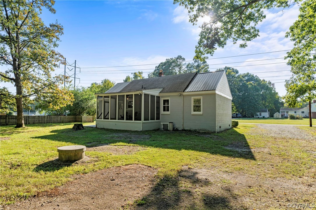 10121 Highview Road Glen Allen, VA 23059 - Photo 23 of 24 Back of house featuring a yard and a sunroom