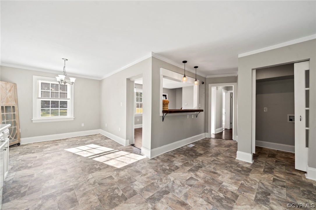 10121 Highview Road Glen Allen, VA 23059 - Photo 10 of 24 Tiled spare room with crown molding and a chandeli