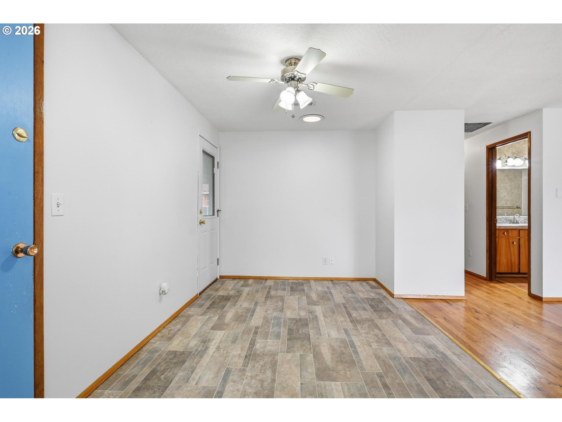 1720 Jansen Way Woodburn, OR 97071 - Photo 12 of 42 a view of an empty room with wooden floor
