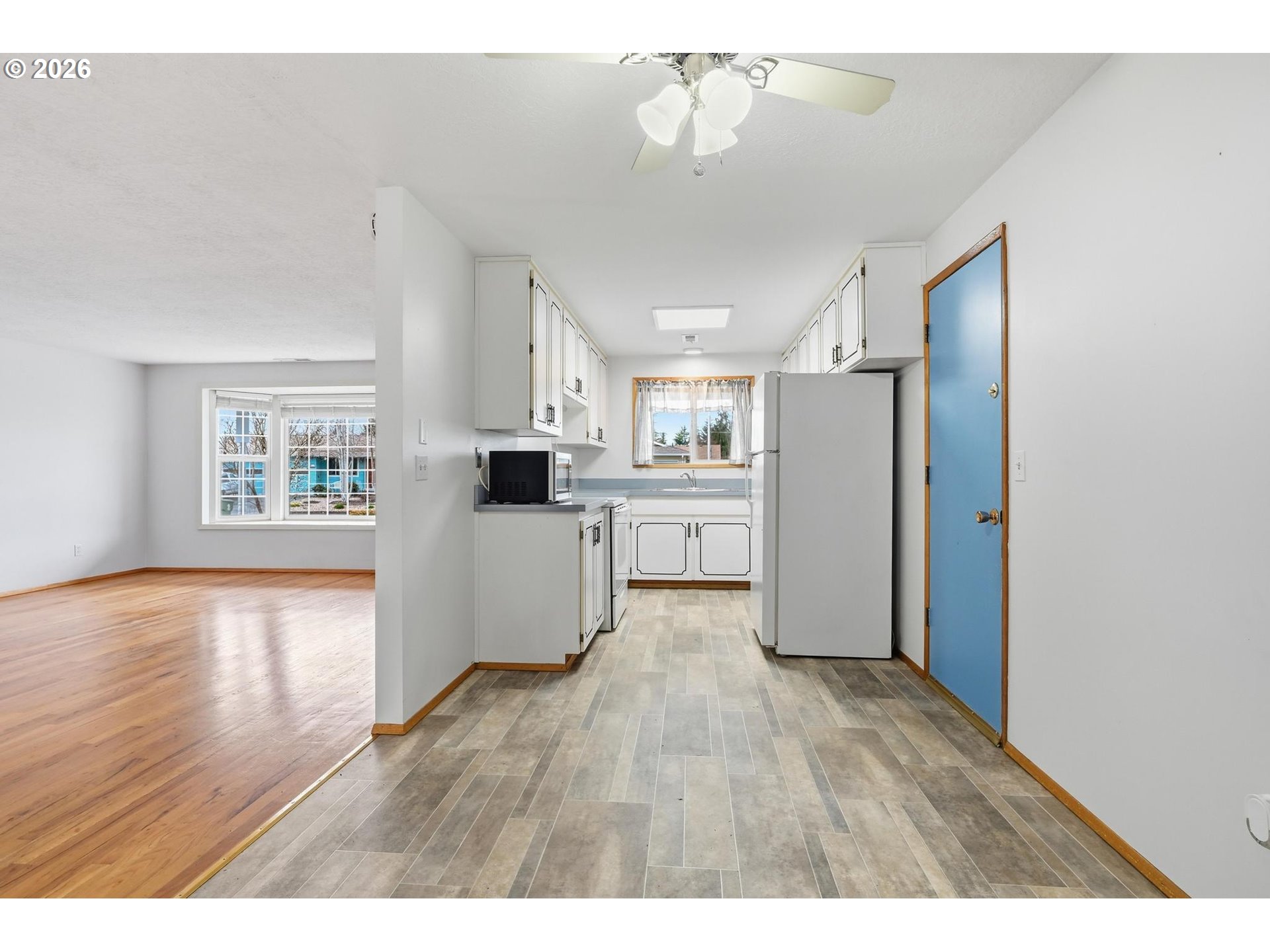 1720 Jansen Way Woodburn, OR 97071 - Photo 15 of 42 a view of kitchen with cabinets and wooden floor