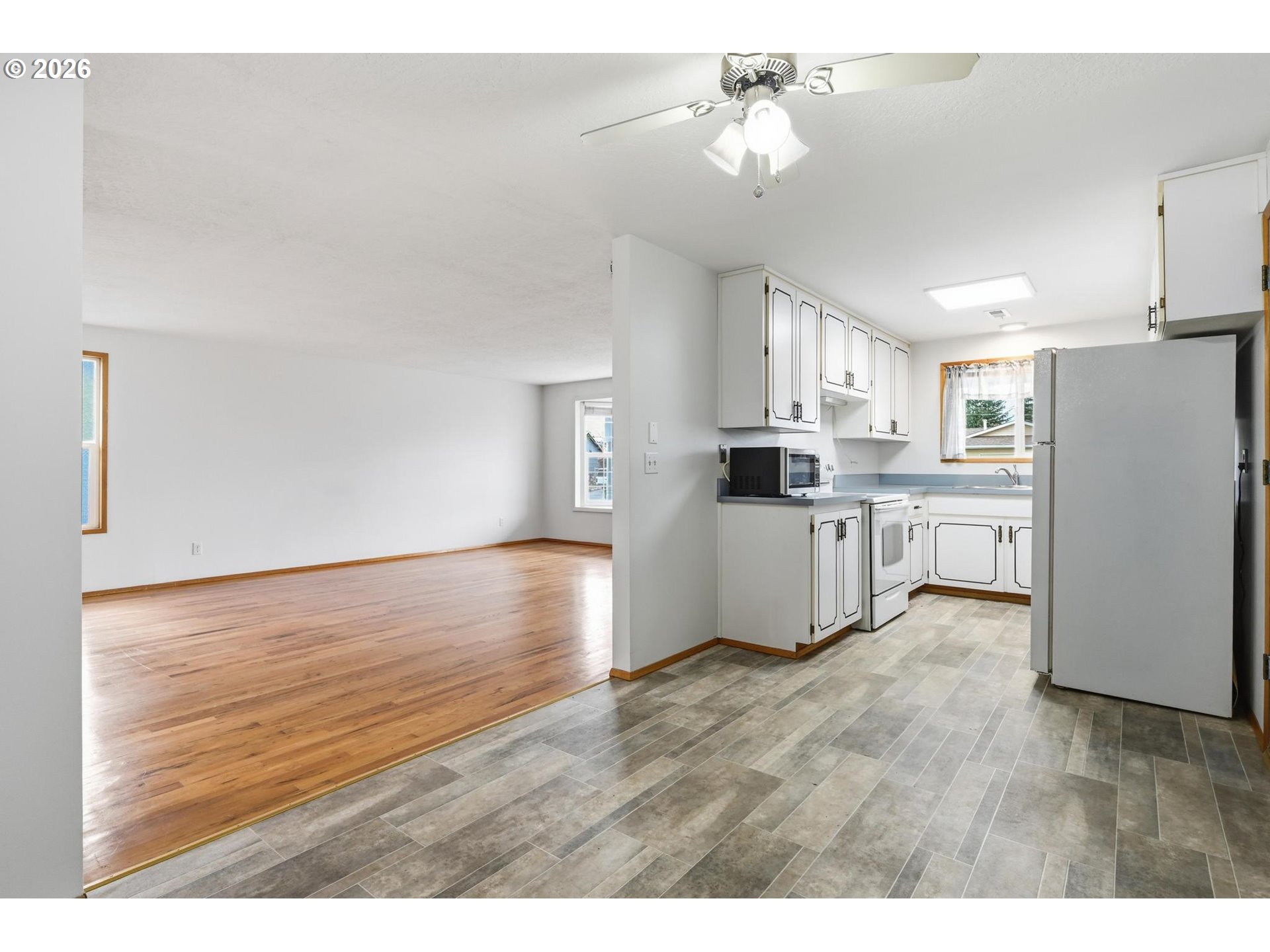 1720 Jansen Way Woodburn, OR 97071 - Photo 16 of 42 a kitchen with stainless steel appliances a refrigerator sink and cabinets