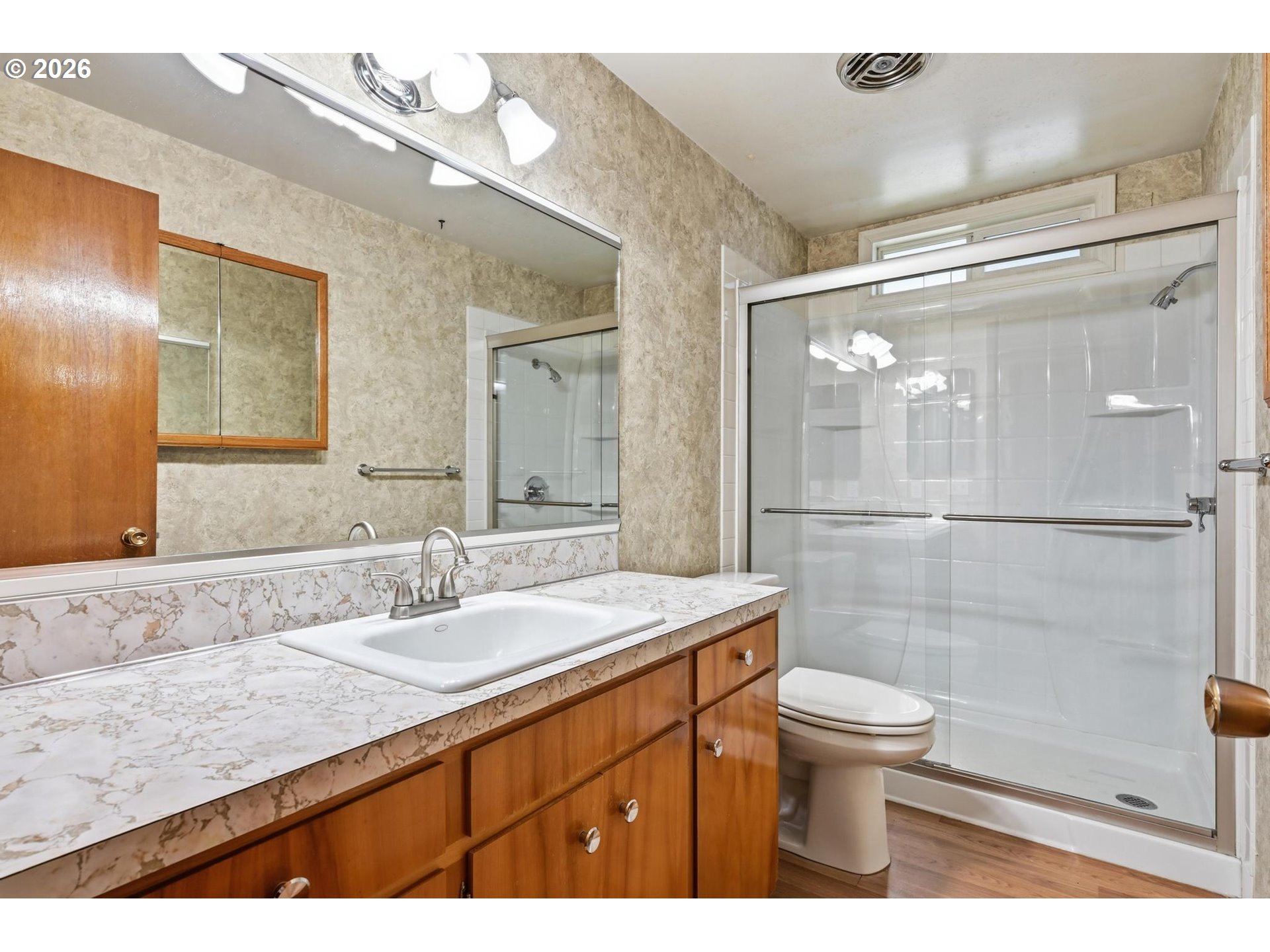 1720 Jansen Way Woodburn, OR 97071 - Photo 22 of 42 a bathroom with a sink a toilet a mirror and shower