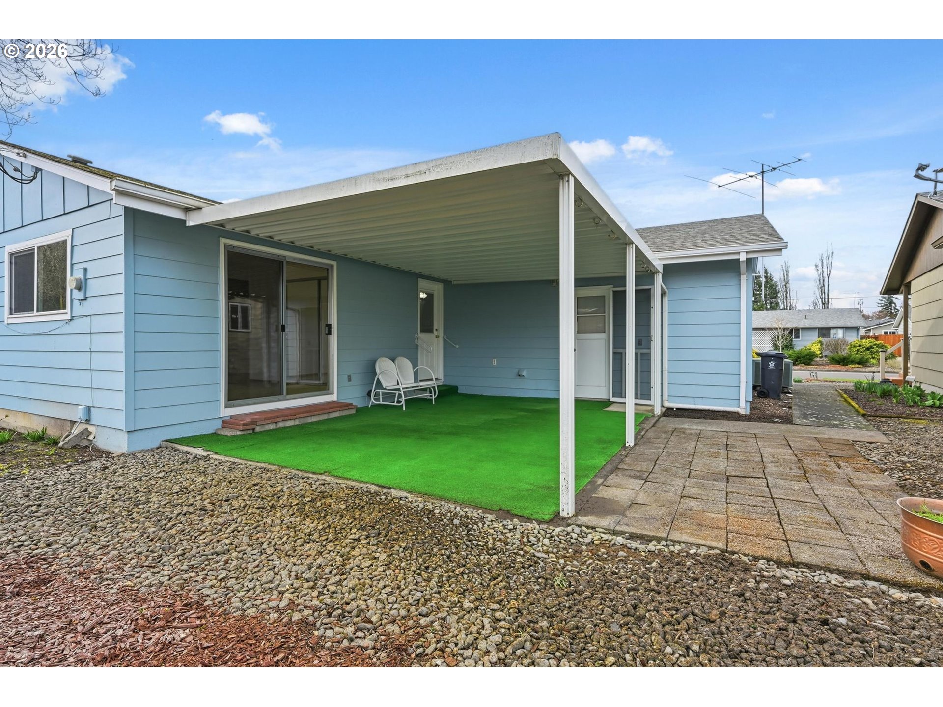 1720 Jansen Way Woodburn, OR 97071 - Photo 33 of 42 a view of a house with a patio and a yard