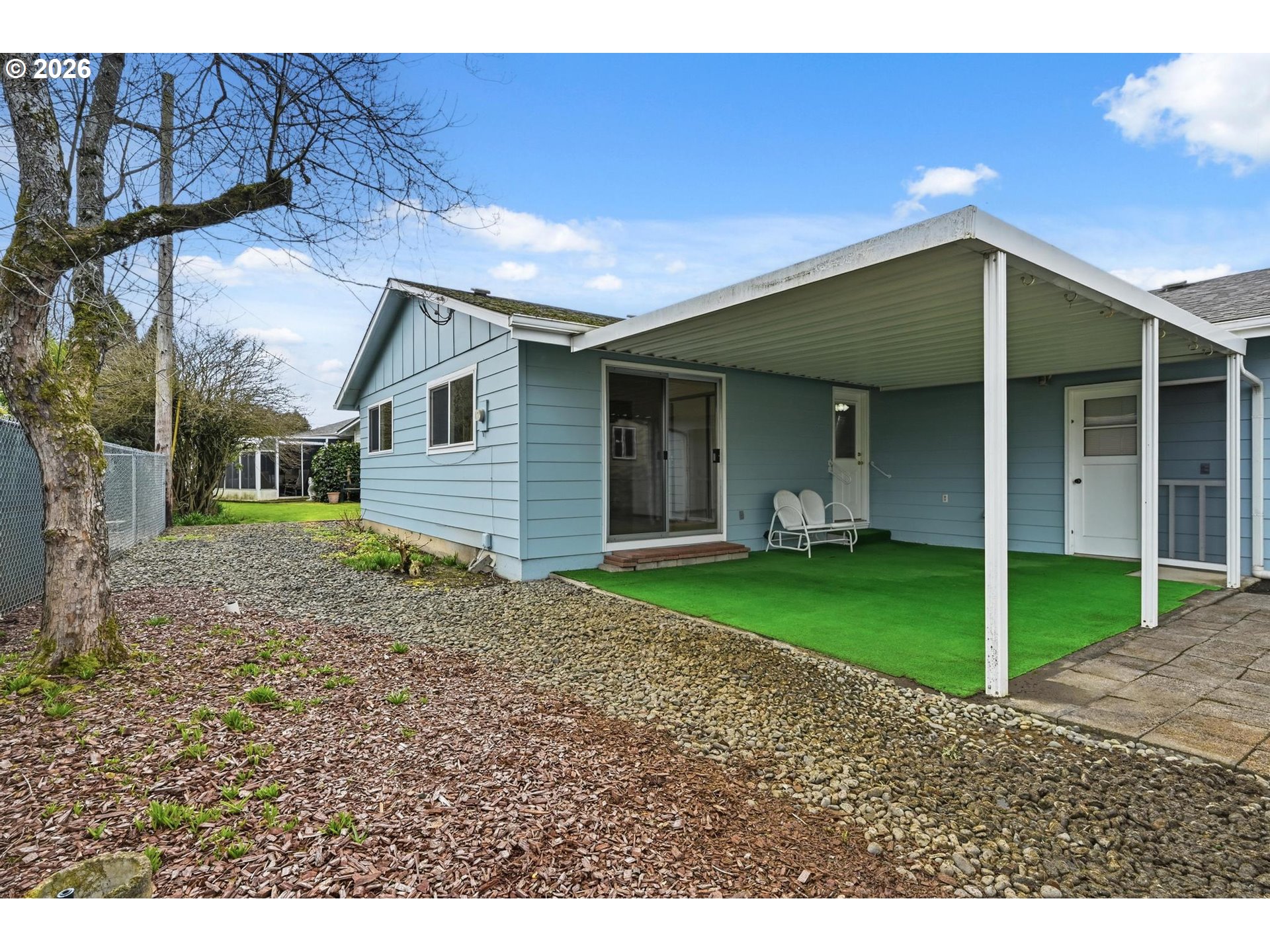 1720 Jansen Way Woodburn, OR 97071 - Photo 34 of 42 a front view of a house with a garden and yard