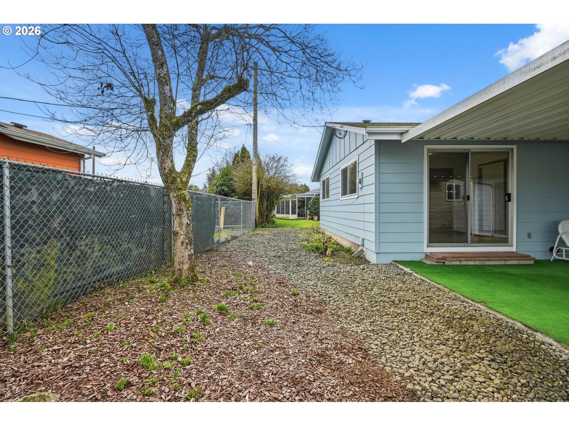 1720 Jansen Way Woodburn, OR 97071 - Photo 35 of 42 a backyard of a house with lots of green space