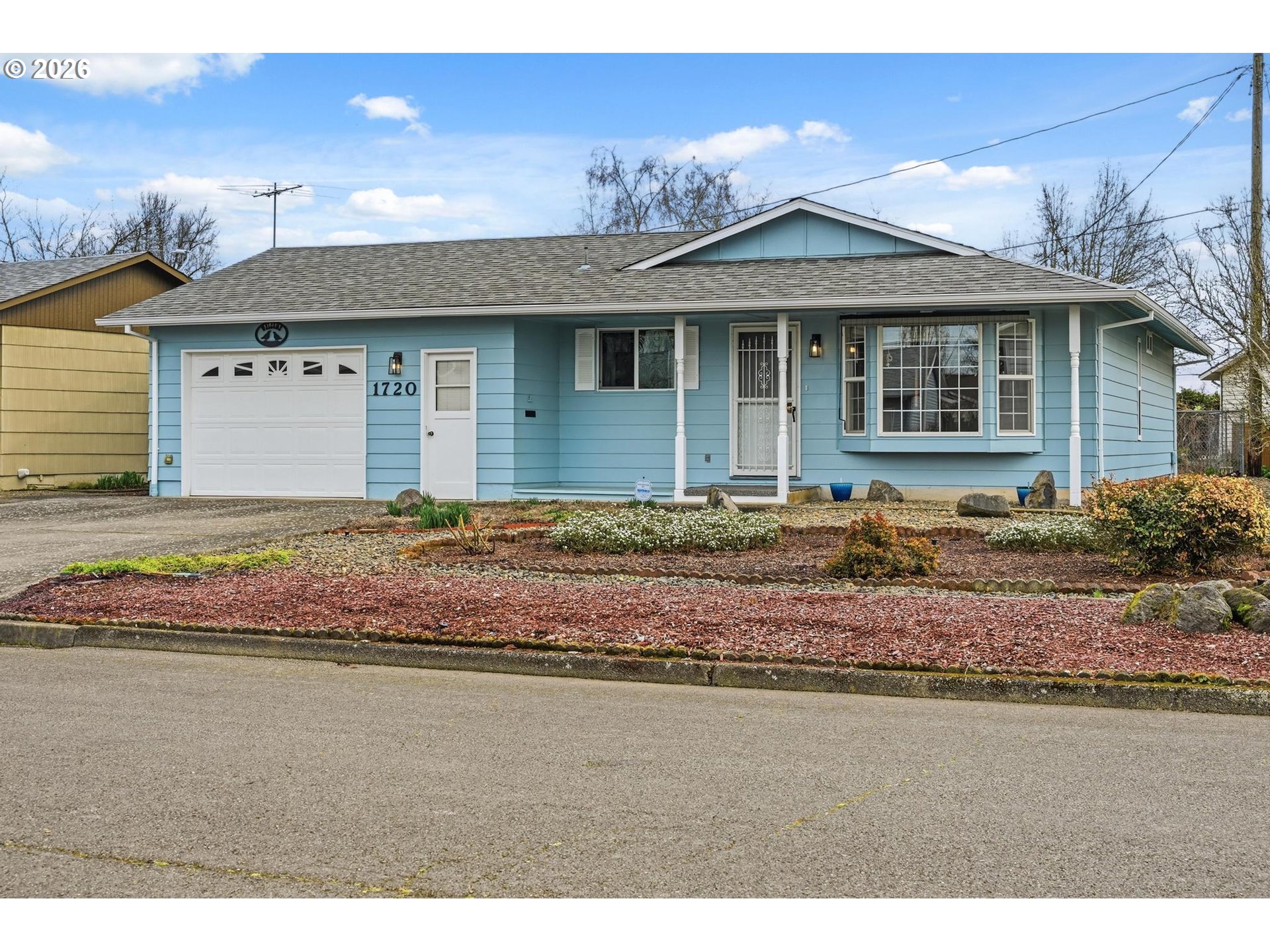 1720 Jansen Way Woodburn, OR 97071 - Photo 37 of 42 a front view of a house with a yard