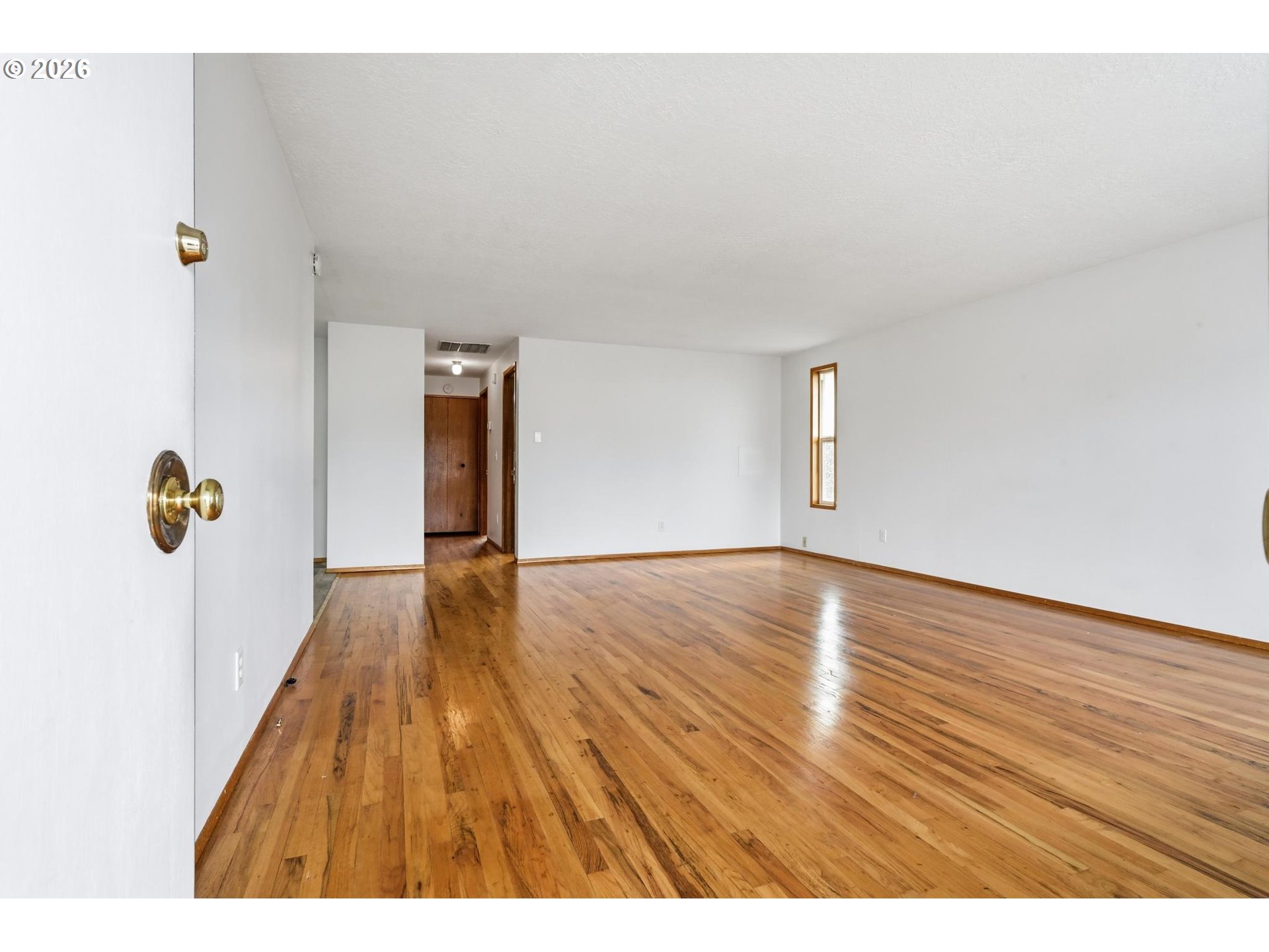 1720 Jansen Way Woodburn, OR 97071 - Photo 4 of 42 a view of empty room with wooden floor