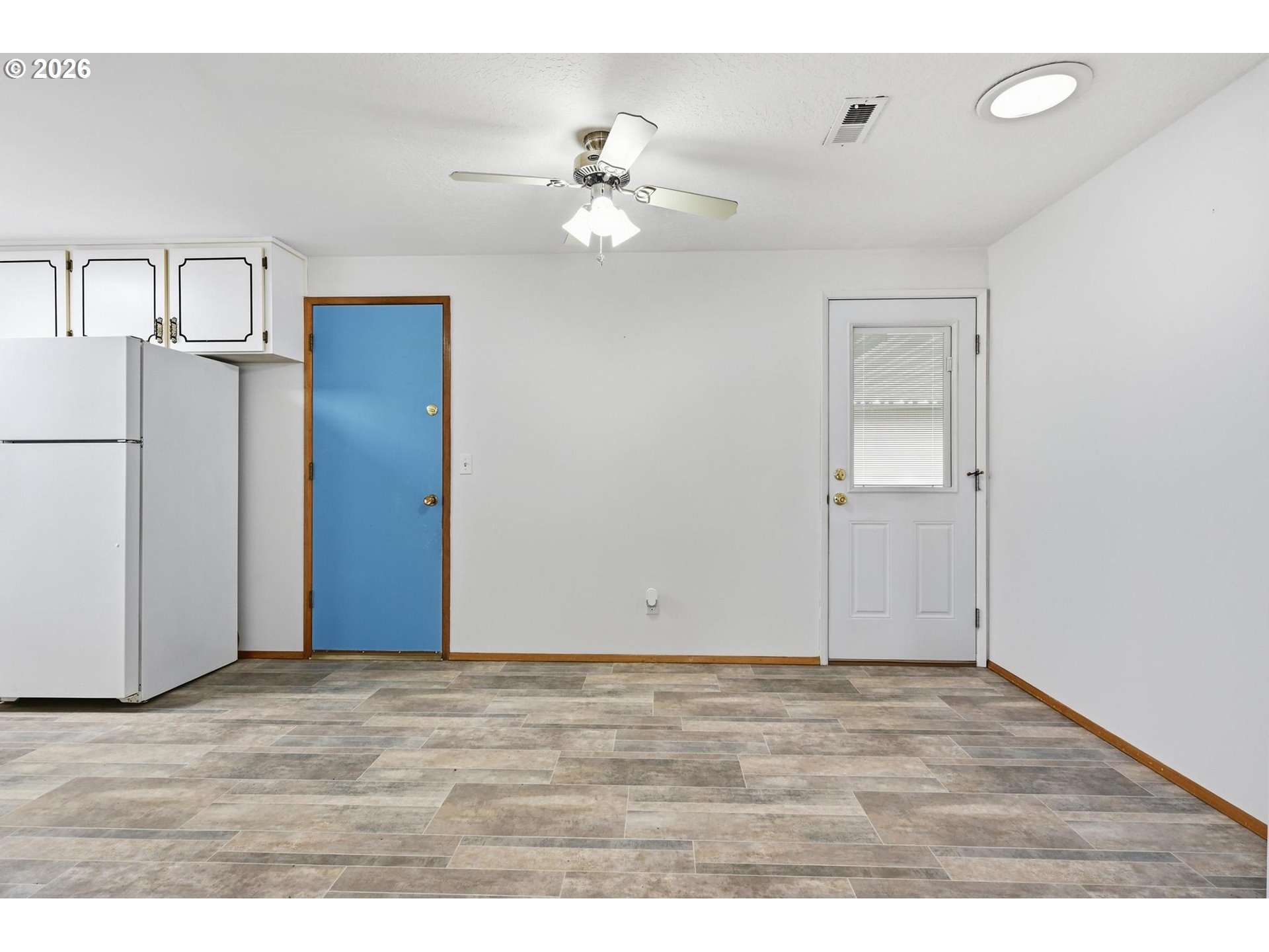 1720 Jansen Way Woodburn, OR 97071 - Photo 10 of 42 a view of an empty room with wooden floor