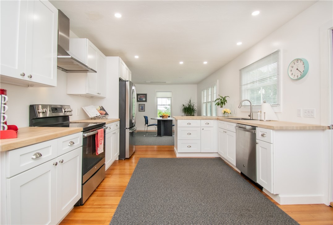1860 East Main Road Portsmouth, RI 02871 - Photo 15 of 29 The kitchen flows into the dining area.
