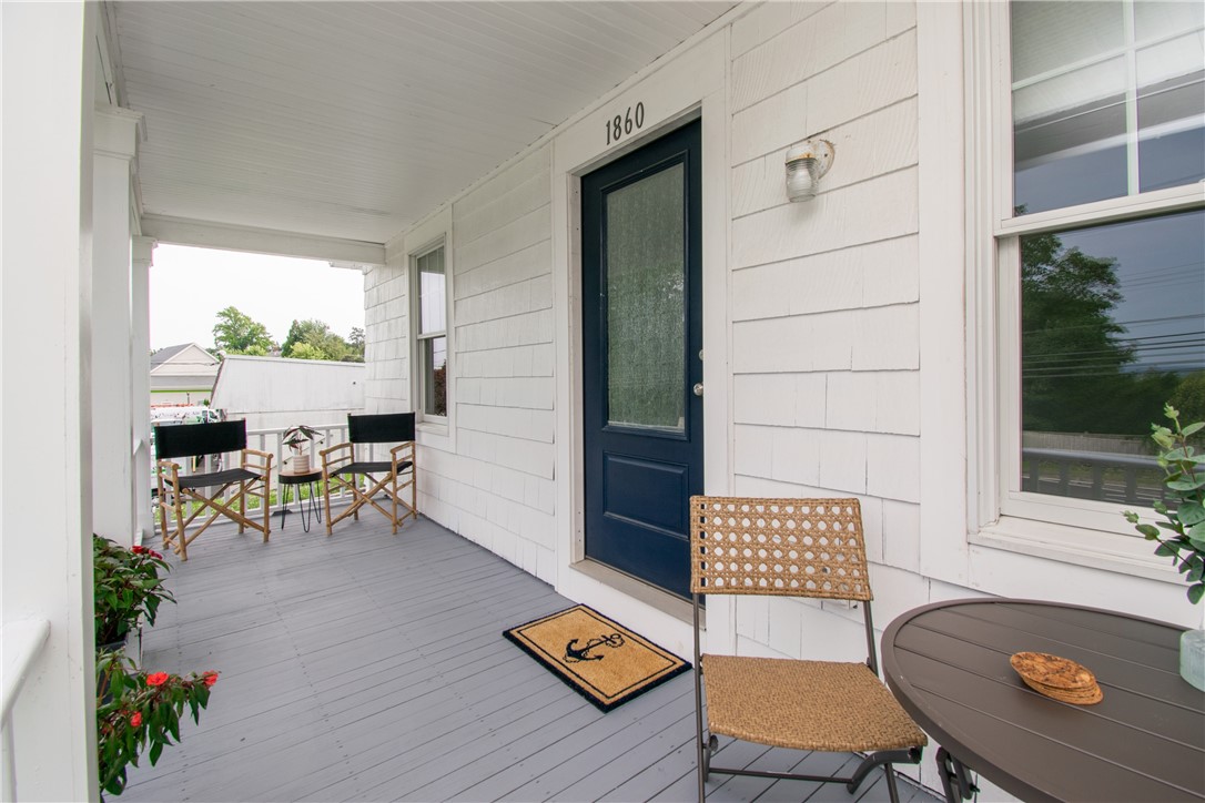 1860 East Main Road Portsmouth, RI 02871 - Photo 4 of 29 Freshly painted front porch. Measuring 22 x 8, there is plenty of room for a few chairs and a table.