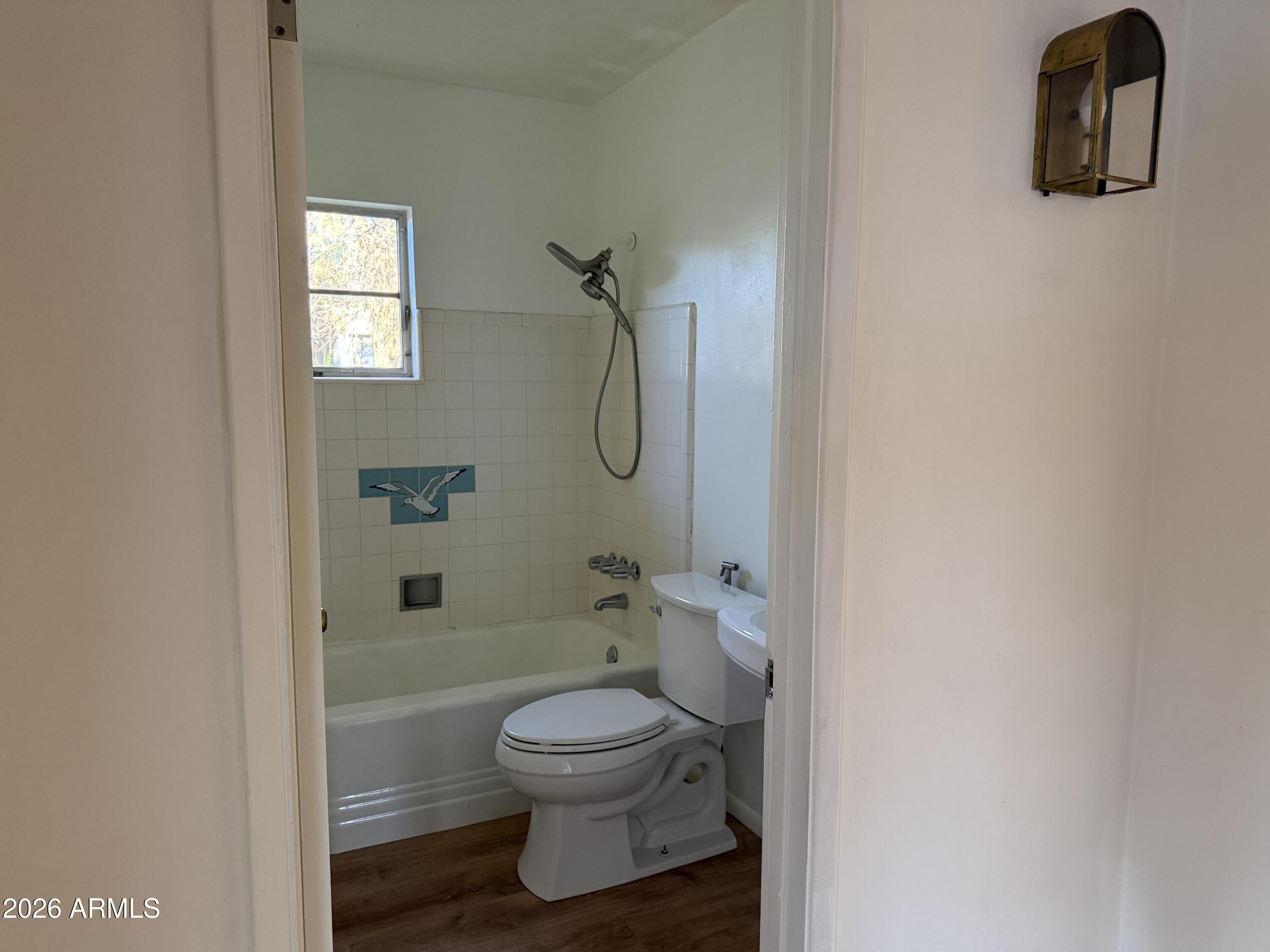 5730 North 4th Street Phoenix, AZ 85012 - Photo 15 of 15 a bathroom with a toilet and a shower