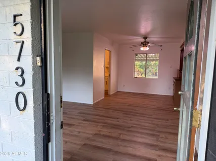 a view of an entryway with wooden floor and windows