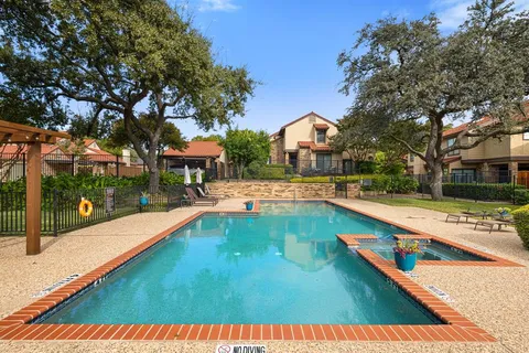 a view of swimming pool with seating space