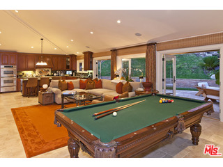 610 Estrellita Way Los Angeles, CA 90049 - Photo 16 of 53 a room with furniture pool table and a large window
