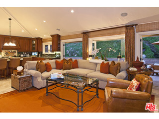 610 Estrellita Way Los Angeles, CA 90049 - Photo 17 of 53 a living room with furniture a large window and a flat screen tv