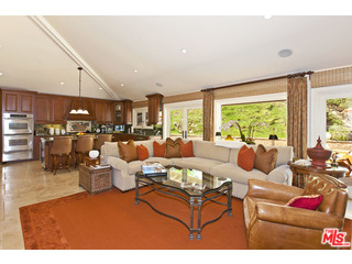 610 Estrellita Way Los Angeles, CA 90049 - Photo 18 of 53 a living room with lots of furniture and a large window