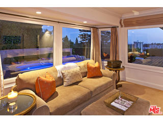 610 Estrellita Way Los Angeles, CA 90049 - Photo 23 of 53 a living room with furniture and a floor to ceiling window