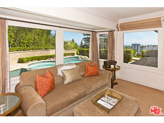 610 Estrellita Way Los Angeles, CA 90049 - Photo 24 of 53 a living room with furniture and a large window