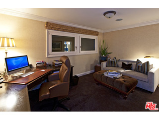 610 Estrellita Way Los Angeles, CA 90049 - Photo 32 of 53 a living room with furniture and a flat screen tv