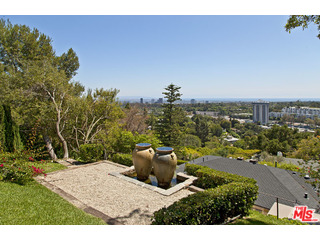 610 Estrellita Way Los Angeles, CA 90049 - Photo 43 of 53 a view of a house with a yard