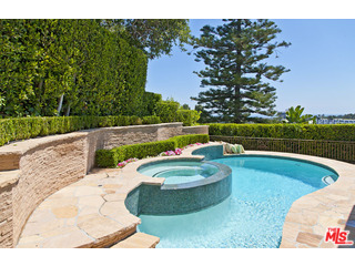 610 Estrellita Way Los Angeles, CA 90049 - Photo 50 of 53 a view of a swimming pool with a yard