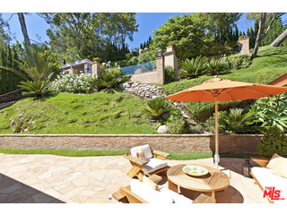 610 Estrellita Way Los Angeles, CA 90049 - Photo 53 of 53 a view of a patio with table and chairs potted plants with wooden fence