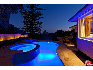 610 Estrellita Way Los Angeles, CA 90049 - Photo 7 of 53 a view of swimming pool a fire pit a sink and a microwave