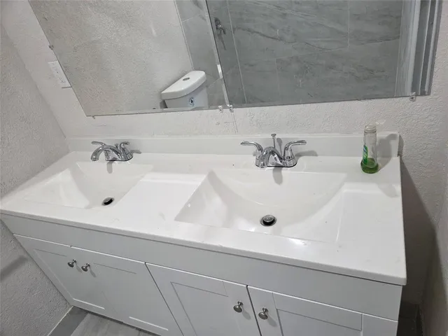 a bathroom with a sink and a shower