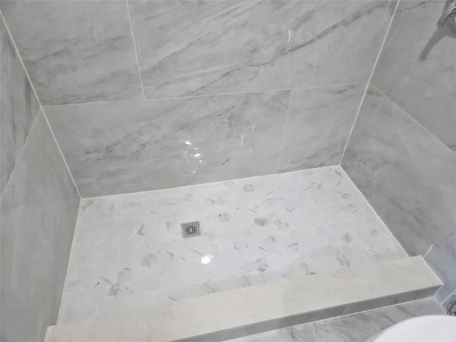 an empty room with a empty space and windows