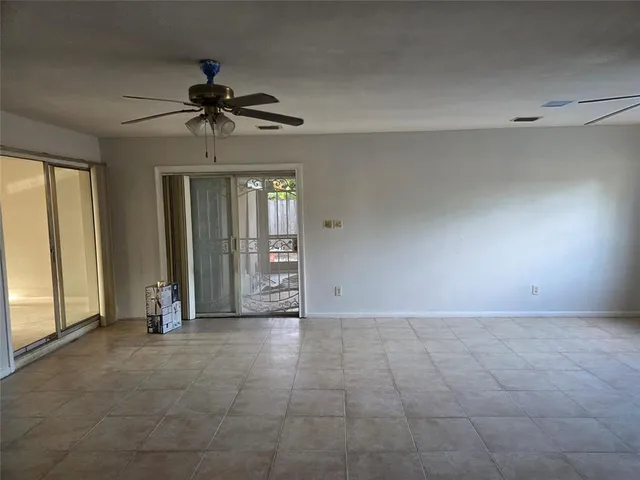 a view of a chandelier fan in a room