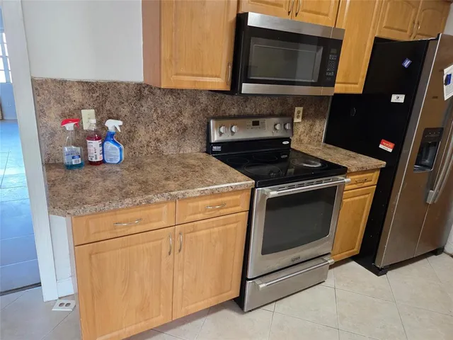 a bathroom with a sink and a washer dryer
