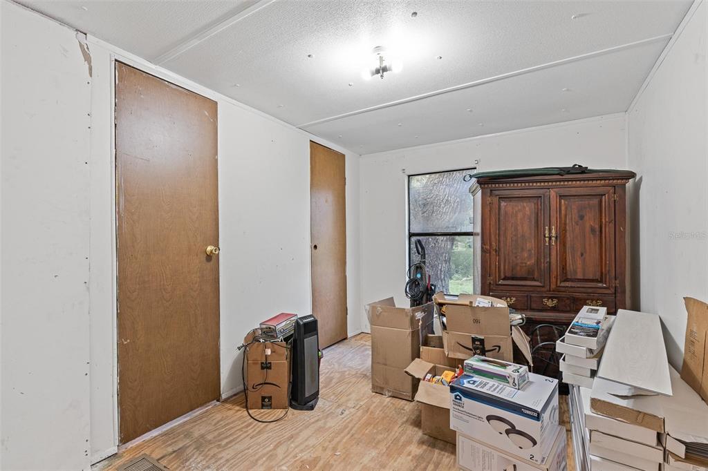 20072 Southeast 155th Place Umatilla, FL 32784 - Photo 12 of 30 a room with furniture a rug and a window