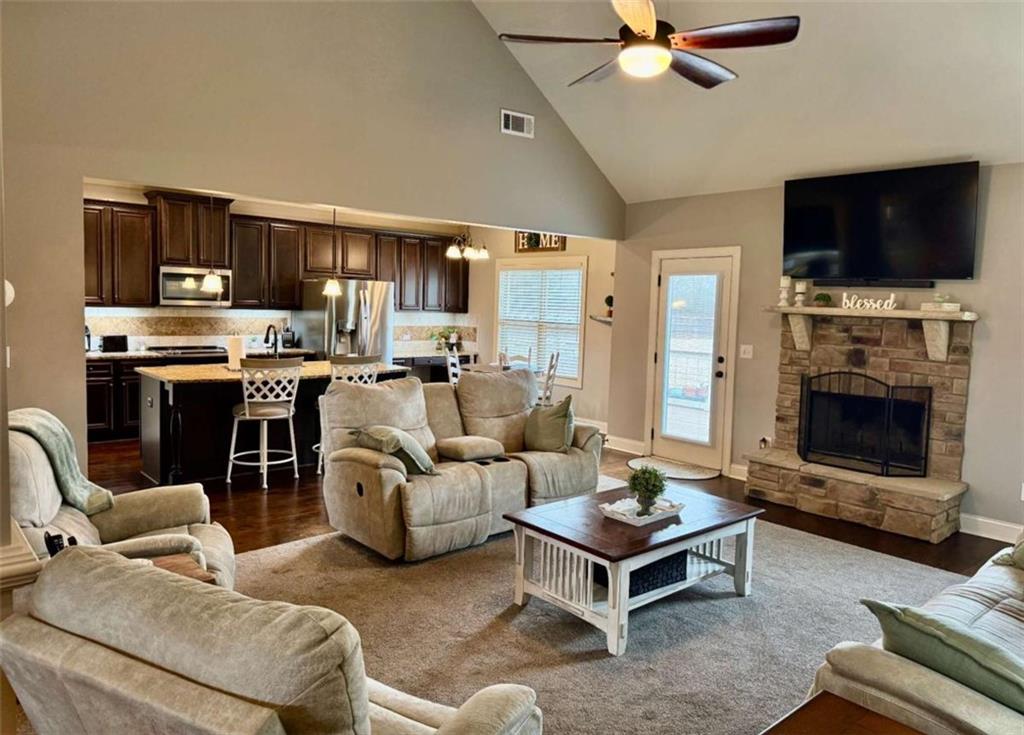 107 Feather Lane Jackson, GA 30233 - Photo 14 of 30 a living room with furniture a flat screen tv and a fireplace
