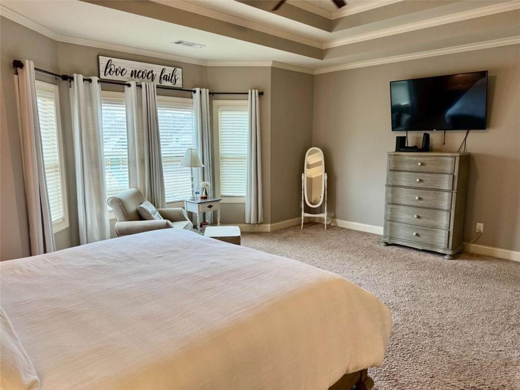 107 Feather Lane Jackson, GA 30233 - Photo 17 of 30 a bedroom with a bed and a flat screen tv