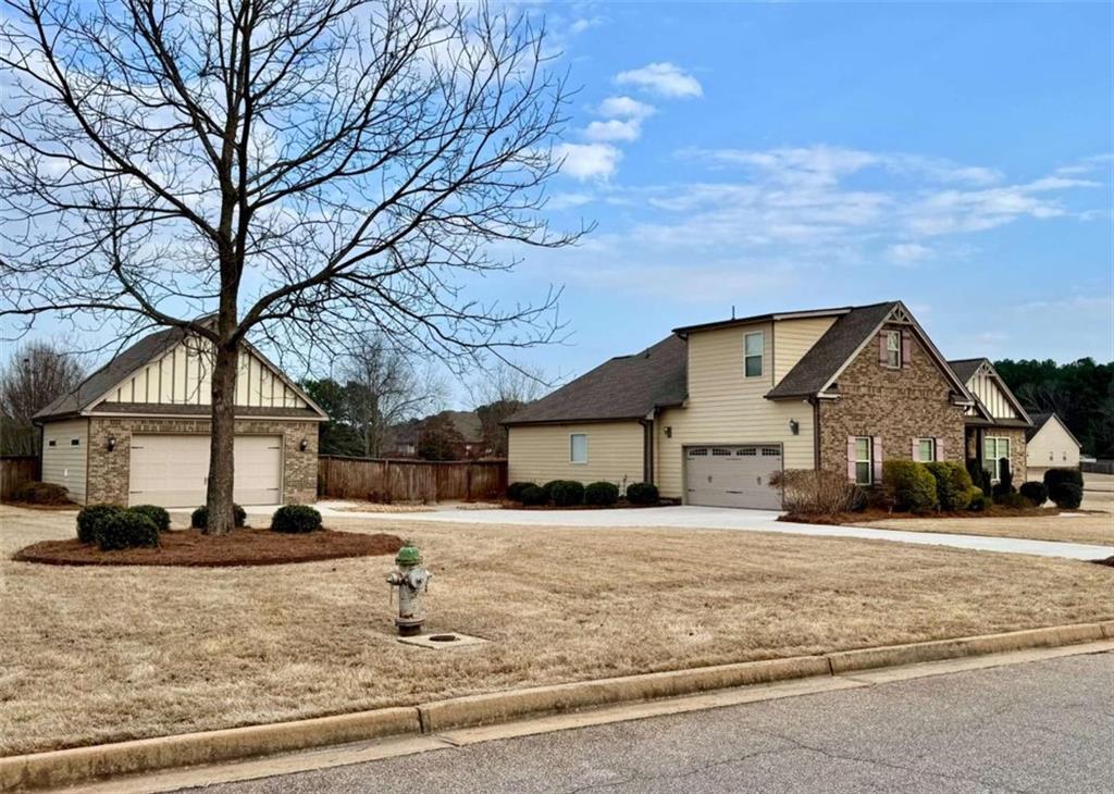 107 Feather Lane Jackson, GA 30233 - Photo 2 of 30 a front view of a house with a yard