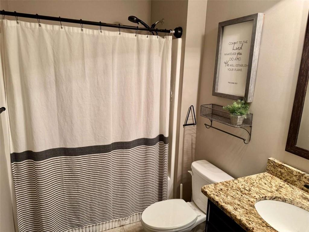 107 Feather Lane Jackson, GA 30233 - Photo 21 of 30 a bathroom with a sink and toilet