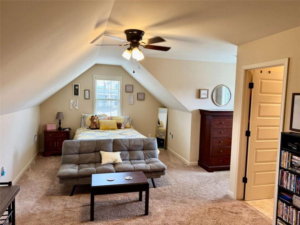 107 Feather Lane Jackson, GA 30233 - Photo 23 of 30 a living room with furniture and a chandelier
