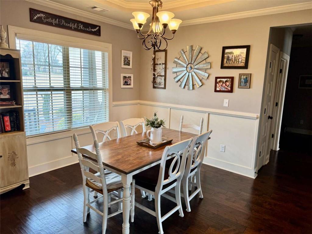 107 Feather Lane Jackson, GA 30233 - Photo 10 of 30 a view of a dining room with furniture window and wooden floor